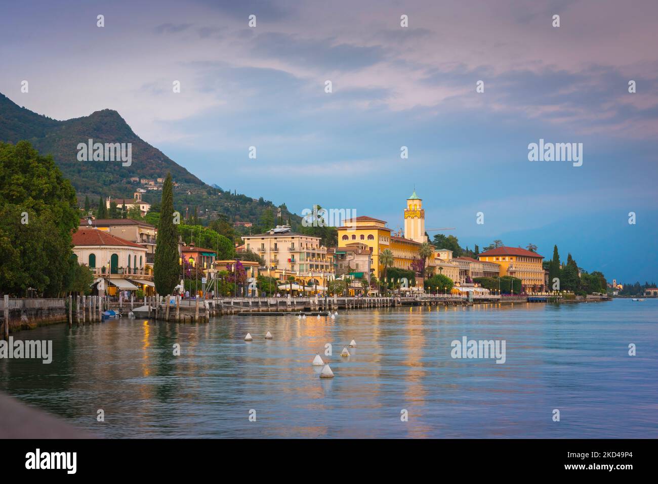 Lake Garda Italy, view at dusk of the scenic lakeside town of Riviera Gardone sited on the south-west side of the lake, Lake Garda, Lombardy, Italy Stock Photo