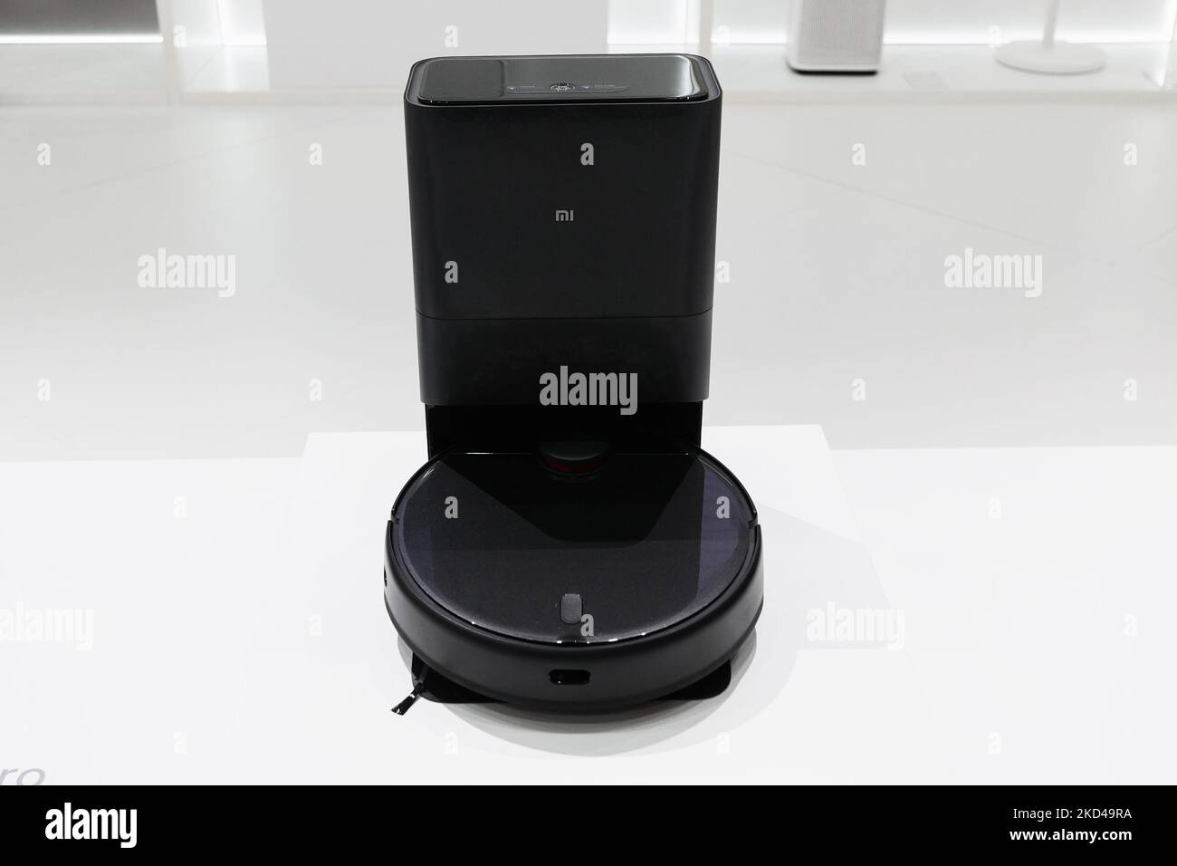 The Mi Robot Vacuum-Mop 2 Ultra with the Auto-Empty Station being exhibited  by the Mi Robot Vacuum-Mop 2 Pro, the two top models of the newest robot  vacuums by Xiaomi, at Mobile