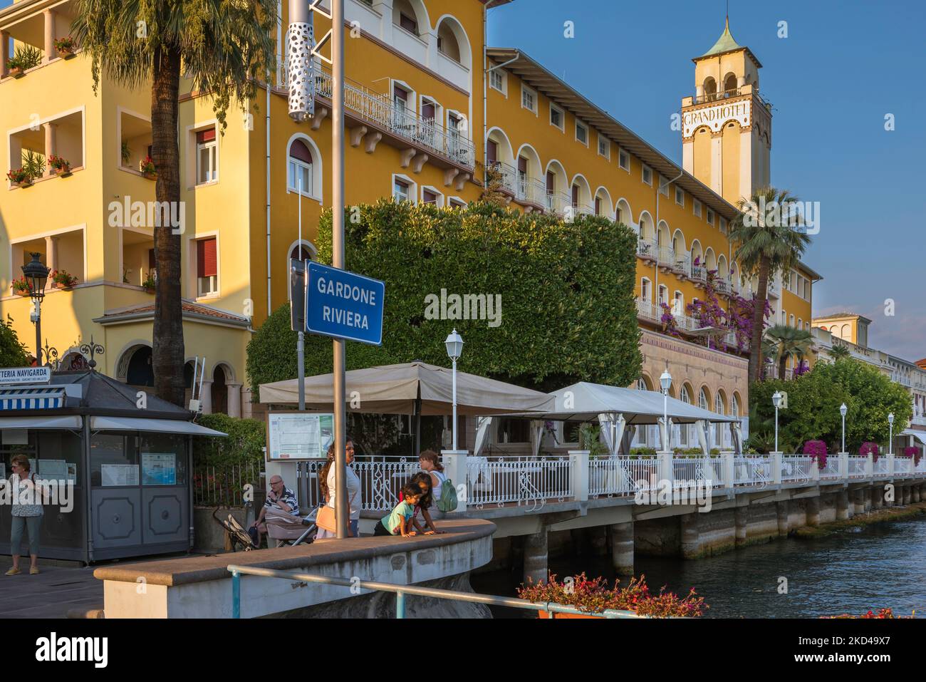Gardone Riviera Italy, view in summer of the ferry station and the popular lakeside Grand Hotel in Gardone Riviera, Lake Garda, Lombardy, Italy Stock Photo