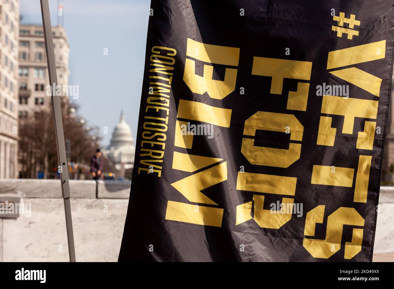 A #VetsforBLM flag hangs in Freedom Plaza during a rally against white nationalism hosted by military veteran organizations Continue to Serve and Common Defense. Organizers held the rally to counter messaging from some in the trucker convoy near Washington. (Photo by Allison Bailey/NurPhoto) Stock Photo