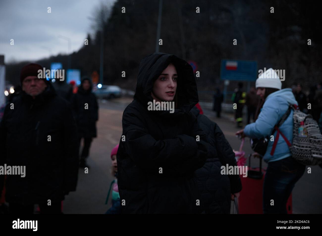 A girl waits for her family to cross the border in Kroscienko, Poland, on March 5, 2022. More than 1 million refugees flee Ukraine in one week since the Russian invasion. While the conflict continues the war refugees keep fleeing from their hometown reaching the Poland border to get access to the European Union. (Photo by Enrico Mattia Del Punta/NurPhoto) Stock Photo