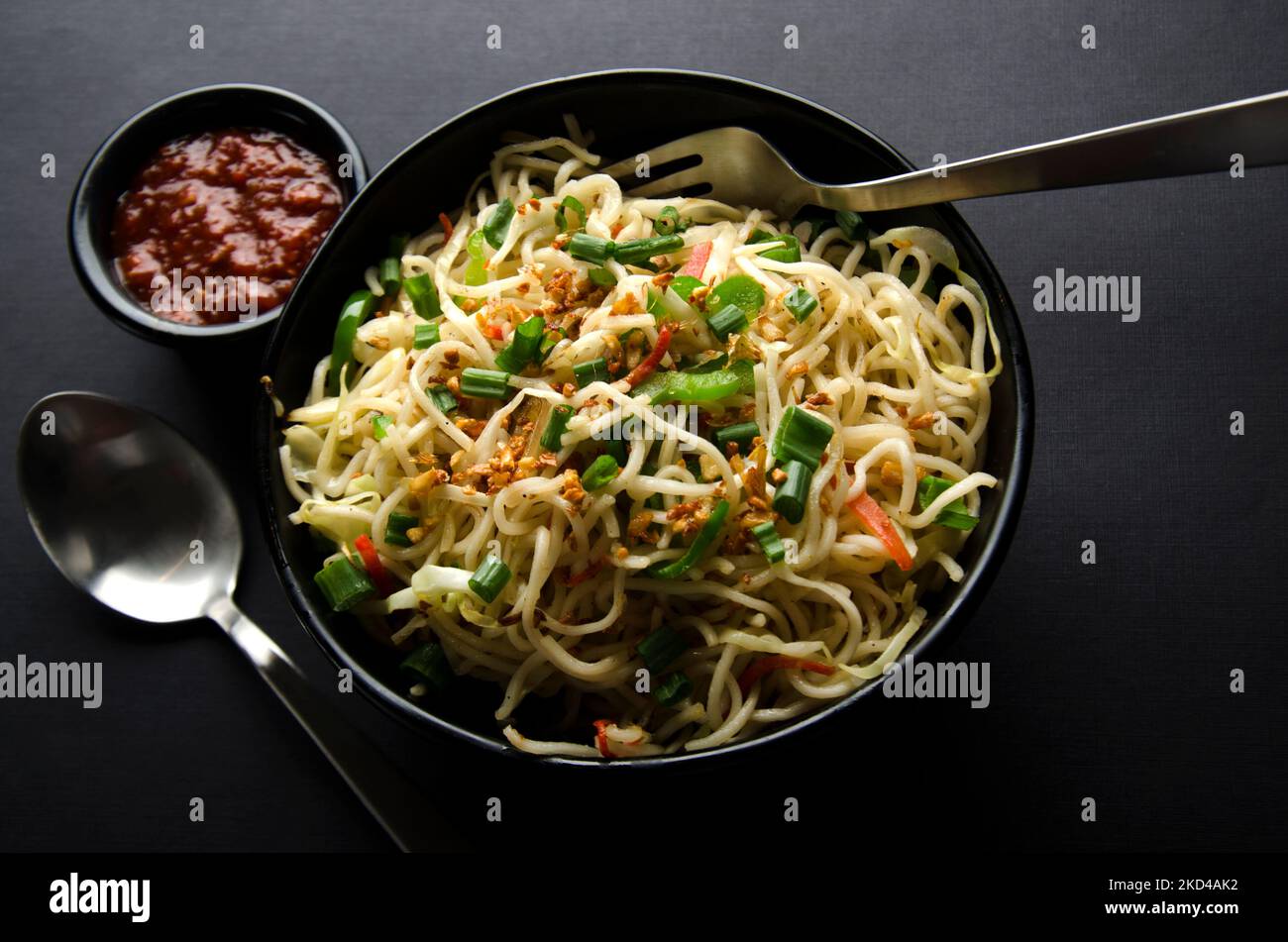 close up of Chinese style shrimp Schezwan noodles, vegetable Hakka
