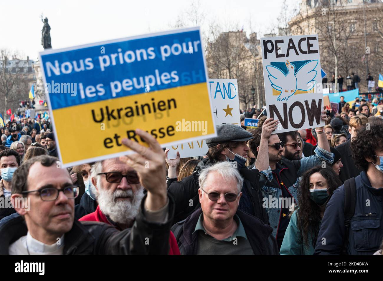 Several thousand people gathered in Paris to participate in a large march from Place de la République to Place de la Bastille to demand peace in Ukraine on the 10th day of the invasion of Russia. Many political figures and ordinary citizens marched amidst Ukrainian flags and slogans for peace and against Putin, in Paris on March 5, 2022. (Photo by Samuel Boivin/NurPhoto) Stock Photo