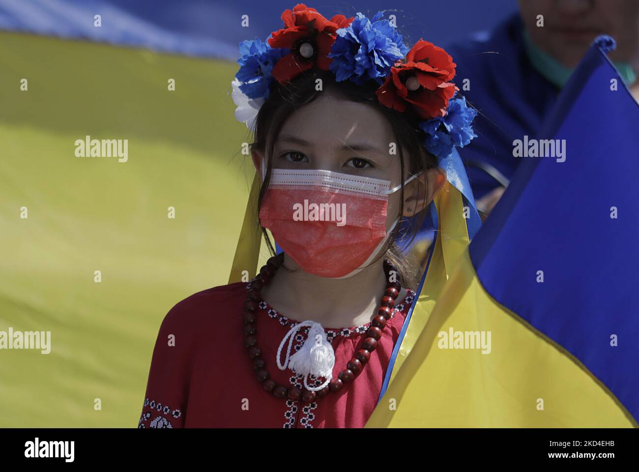 A girl from the Ukrainian community in Mexico City marches to the Angel de la Independencia to protest against Russian President Vladimir Putin, after he ordered the start of a military strategy in several Ukrainian cities. (Photo by Gerardo Vieyra/NurPhoto) Stock Photo