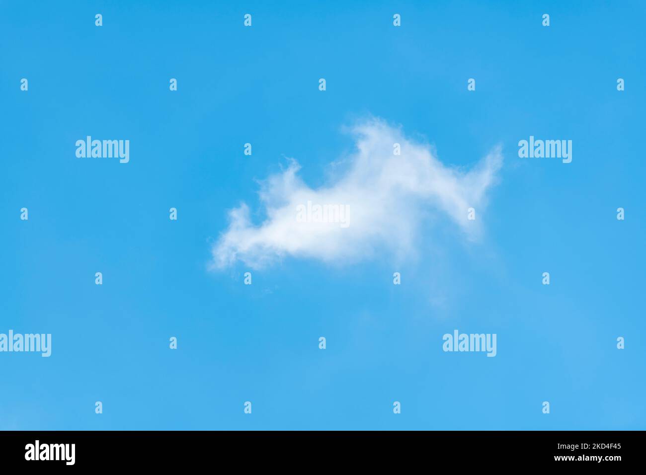 Isolated white cloud against light blue sky Stock Photo Alamy
