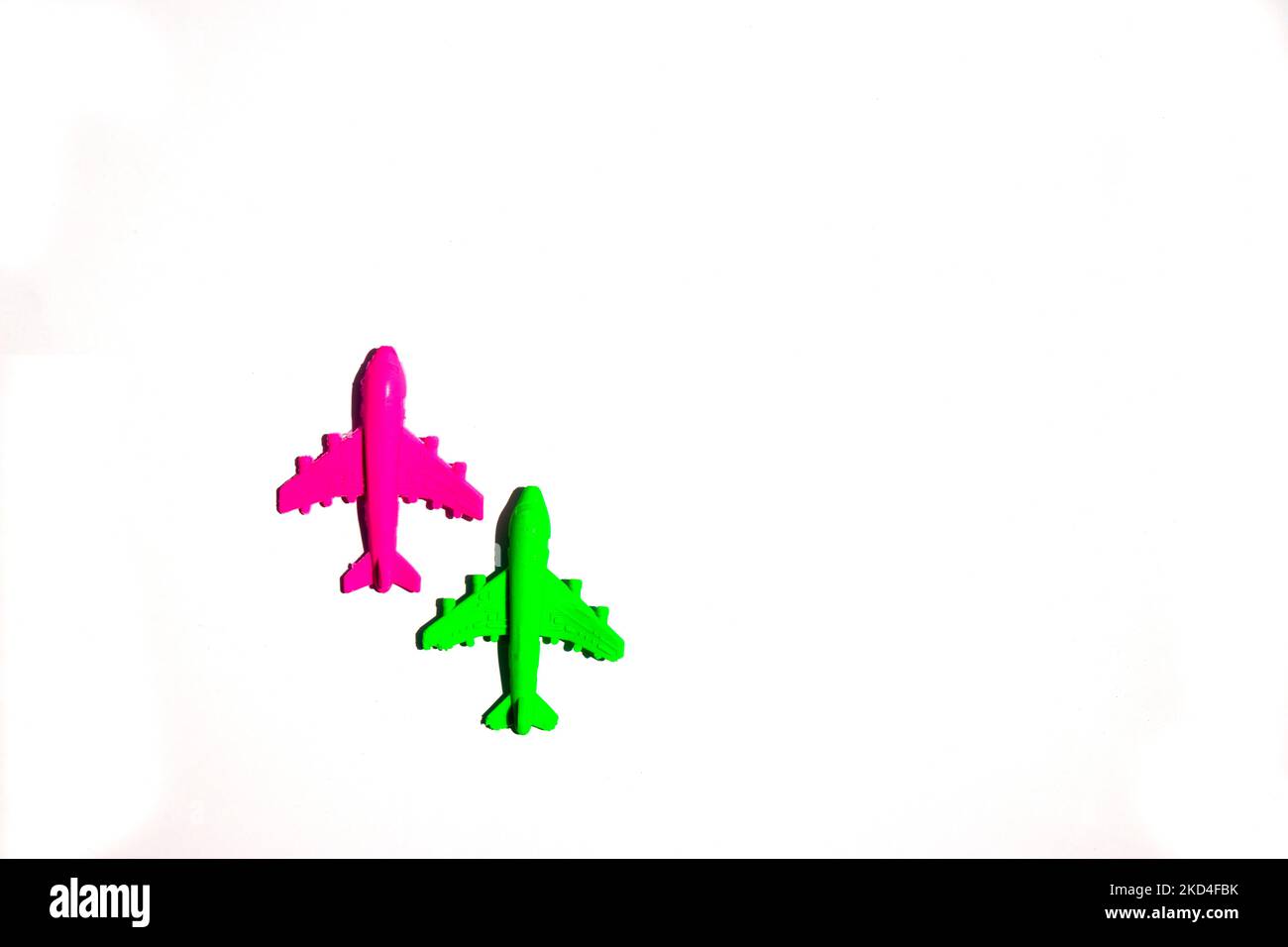 red and green airplane toy on white background Stock Photo - Alamy