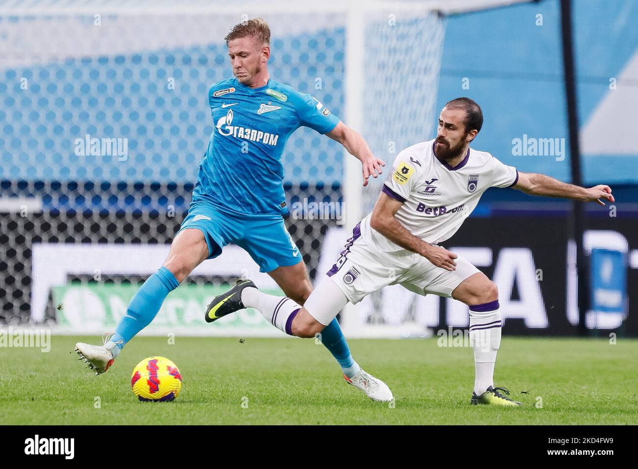 Dmitri Chistyakov (L) of Zenit St. Petersburg and Tiago Rodrigues of Ufa vie for the ball during the Russian Premier League match between FC Zenit Saint Petersburg and FC Ufa on March 7, 2022 at Gazprom Arena in Saint Petersburg, Russia. (Photo by Mike Kireev/NurPhoto) Stock Photo