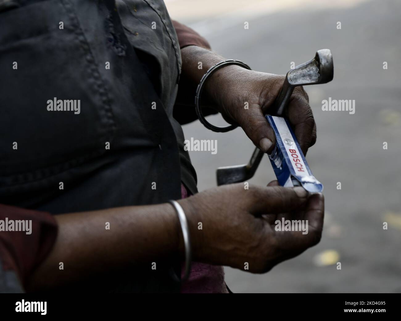 Sonali Mistri, age 51, only woman two wheeler mechanic of Kolkata, works in her garage before the day of International Women's Day, Kolkata, India, 07 March, 2022. (Photo by Indranil Aditya/NurPhoto) Stock Photo