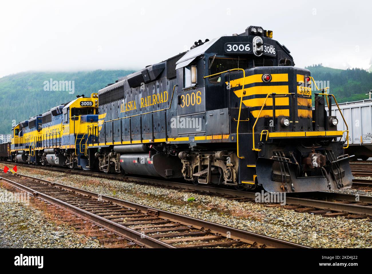 Alaska Railroad depot and locomotive train; Whittier, Alaska, USA. A tunnel from Whittier to Portage is shared by autos and railroad. Stock Photo