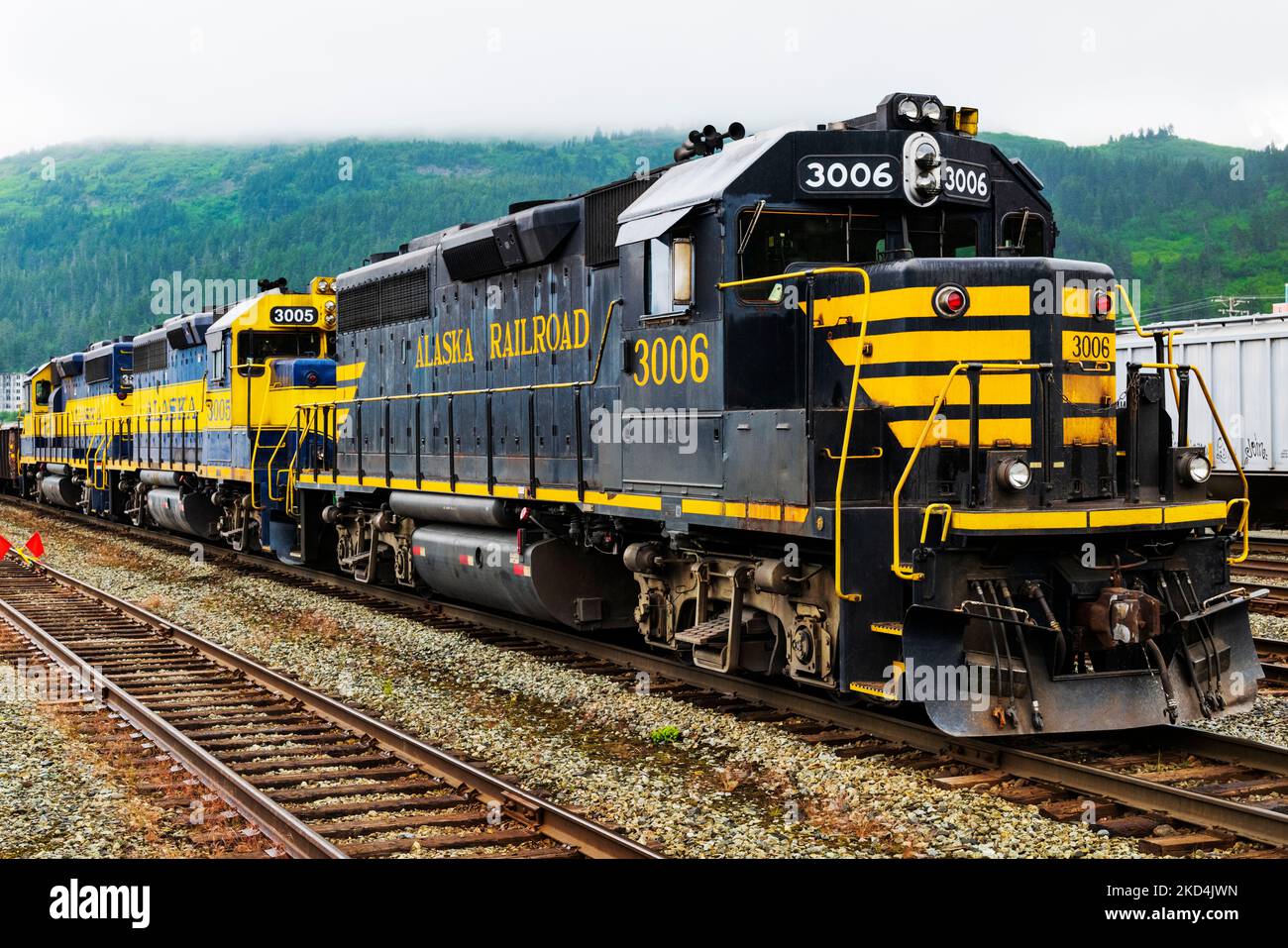 Alaska Railroad depot and locomotive train; Whittier, Alaska, USA. A tunnel from Whittier to Portage is shared by autos and railroad. Stock Photo