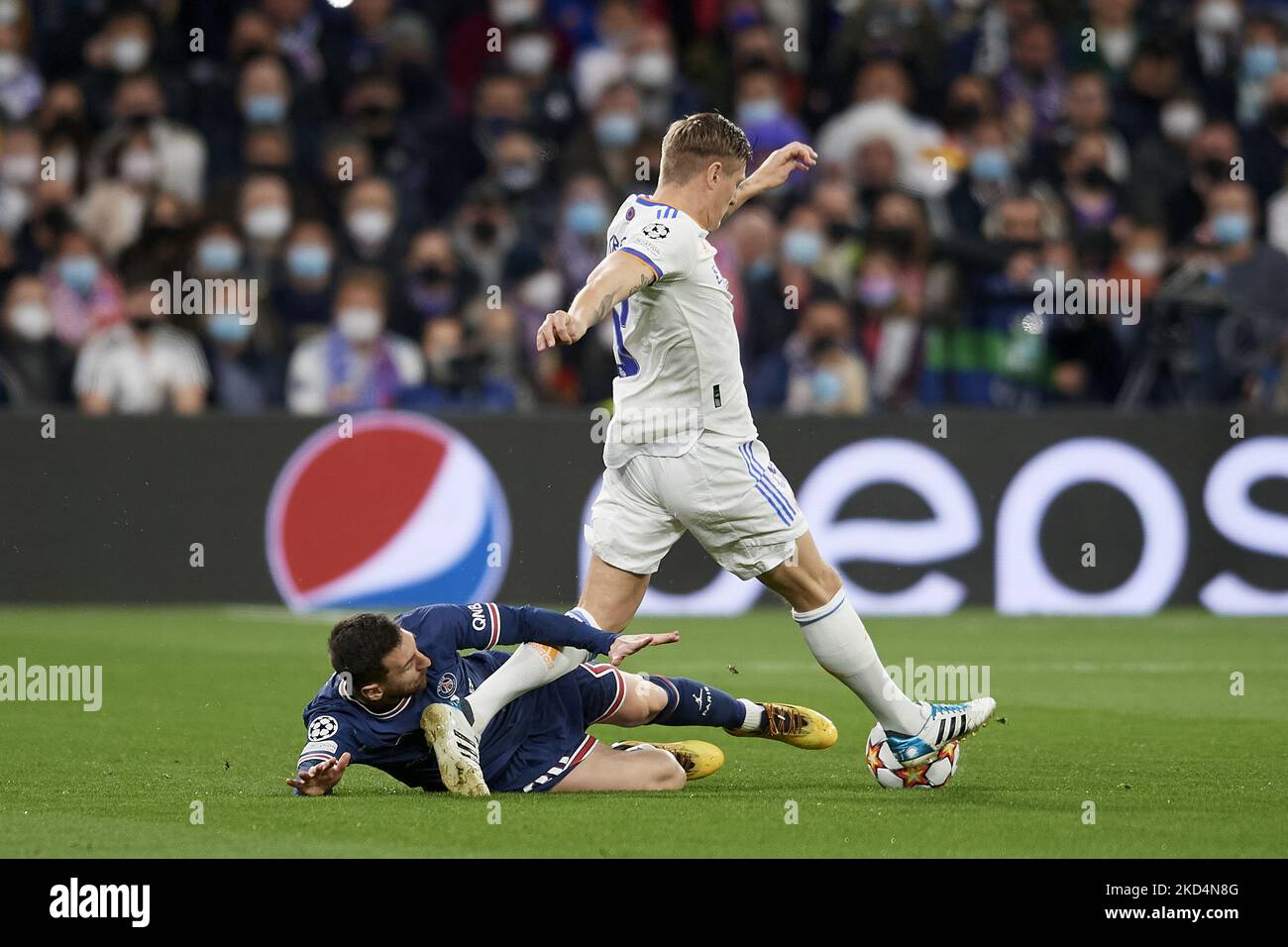 Leo Messi of PSG and Toni Kroos of Real Madrid compete for the ball during the UEFA Champions League Round Of Sixteen Leg Two match between Real Madrid and Paris Saint-Germain at Estadio Santiago Bernabeu on March 9, 2022 in Madrid, Spain. (Photo by Jose Breton/Pics Action/NurPhoto) Stock Photo
