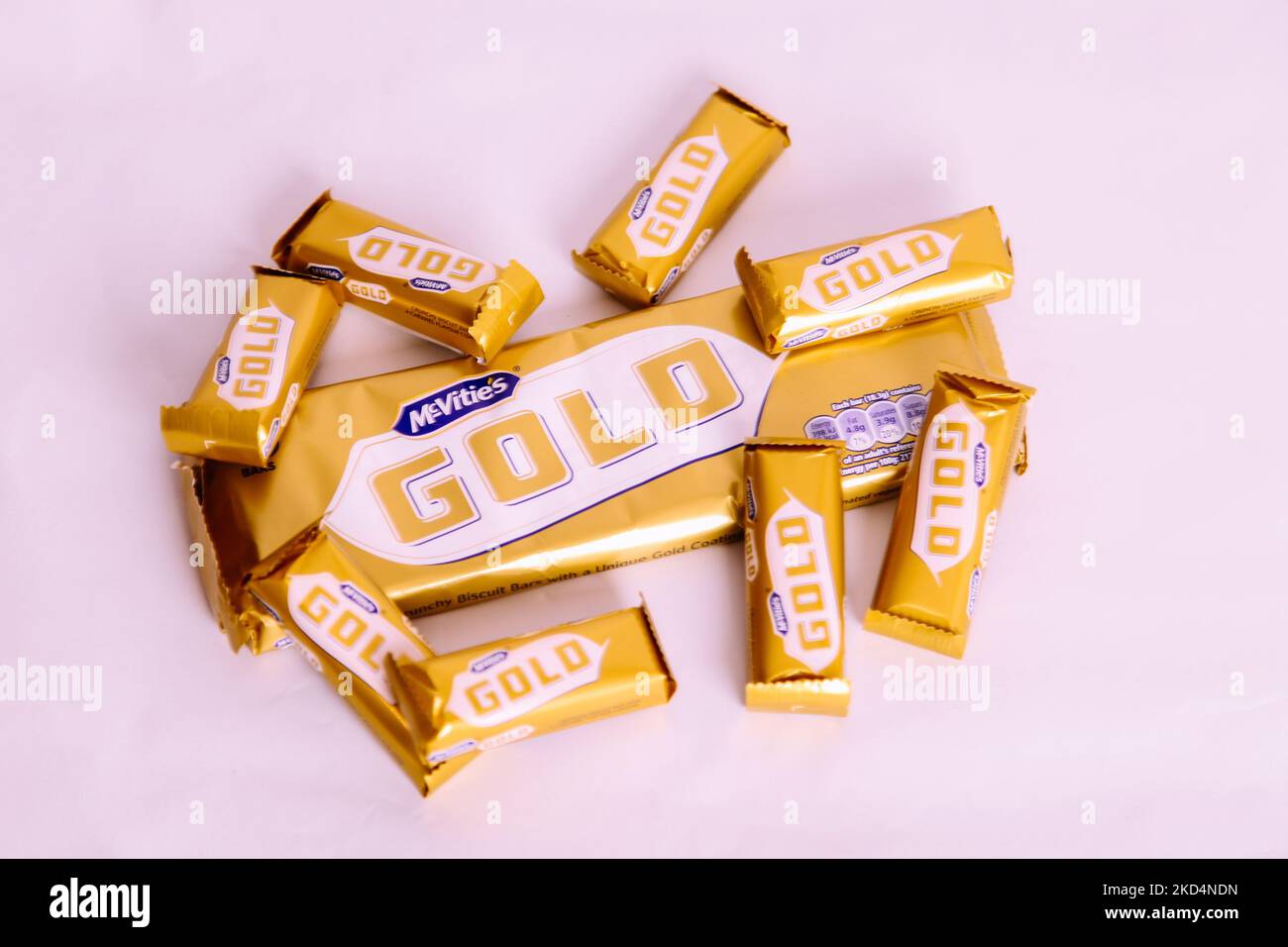 McVities Gold Bar Multipack surrounded by wrapped individual gold bars - golden chocolate bar snack treat Stock Photo