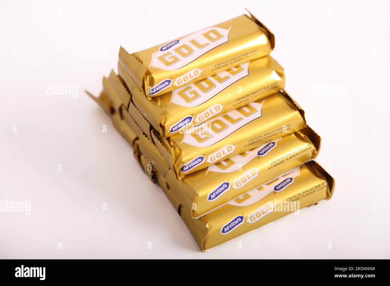 Stack of McVities Gold Bars in neat pile - multiple golden chocolate bar snack treat Stock Photo