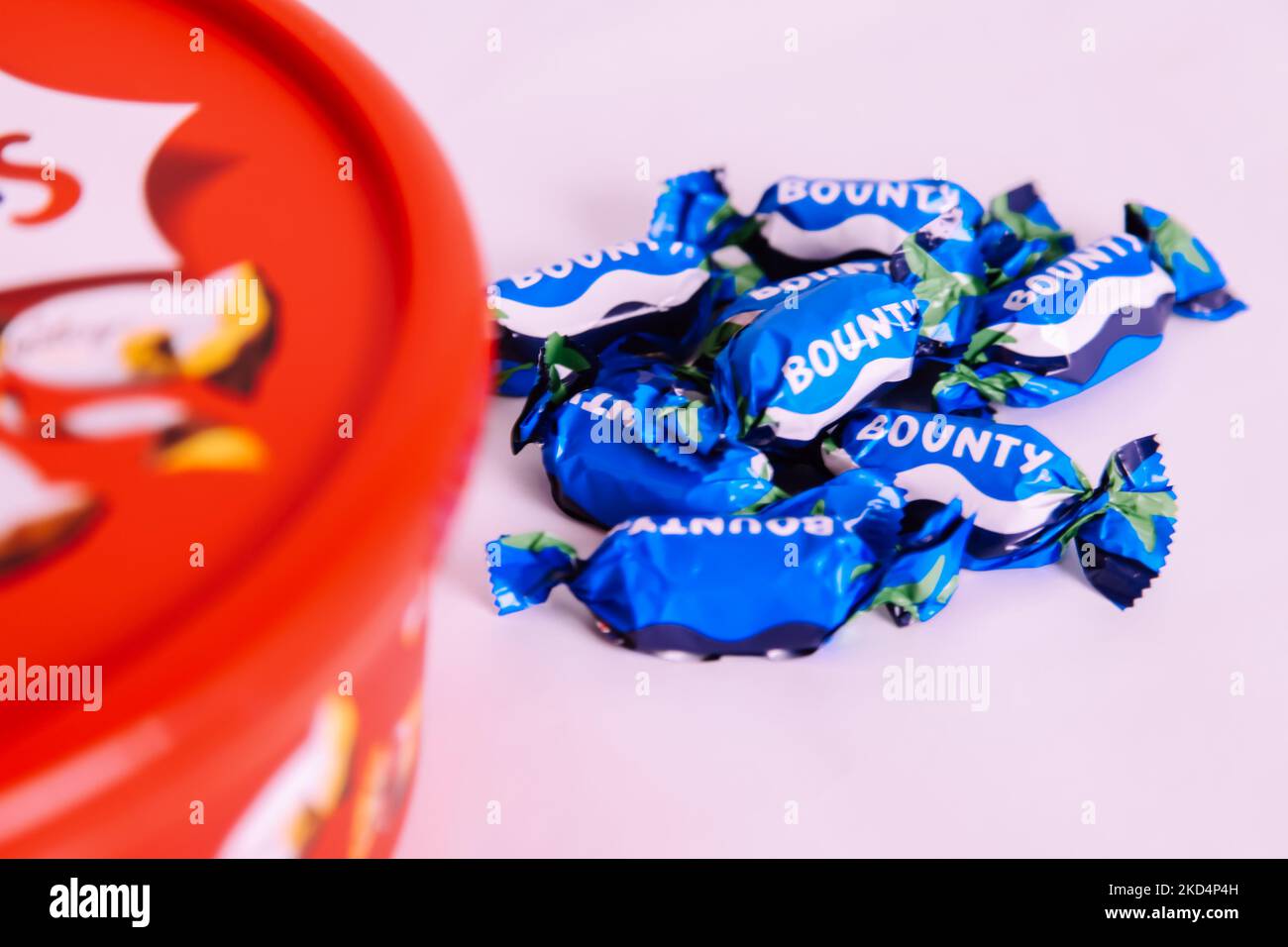 Plastic tub of Celebrations chocolate treat sweets 2022 Christmas edition - Bounty bar sweet left out Stock Photo