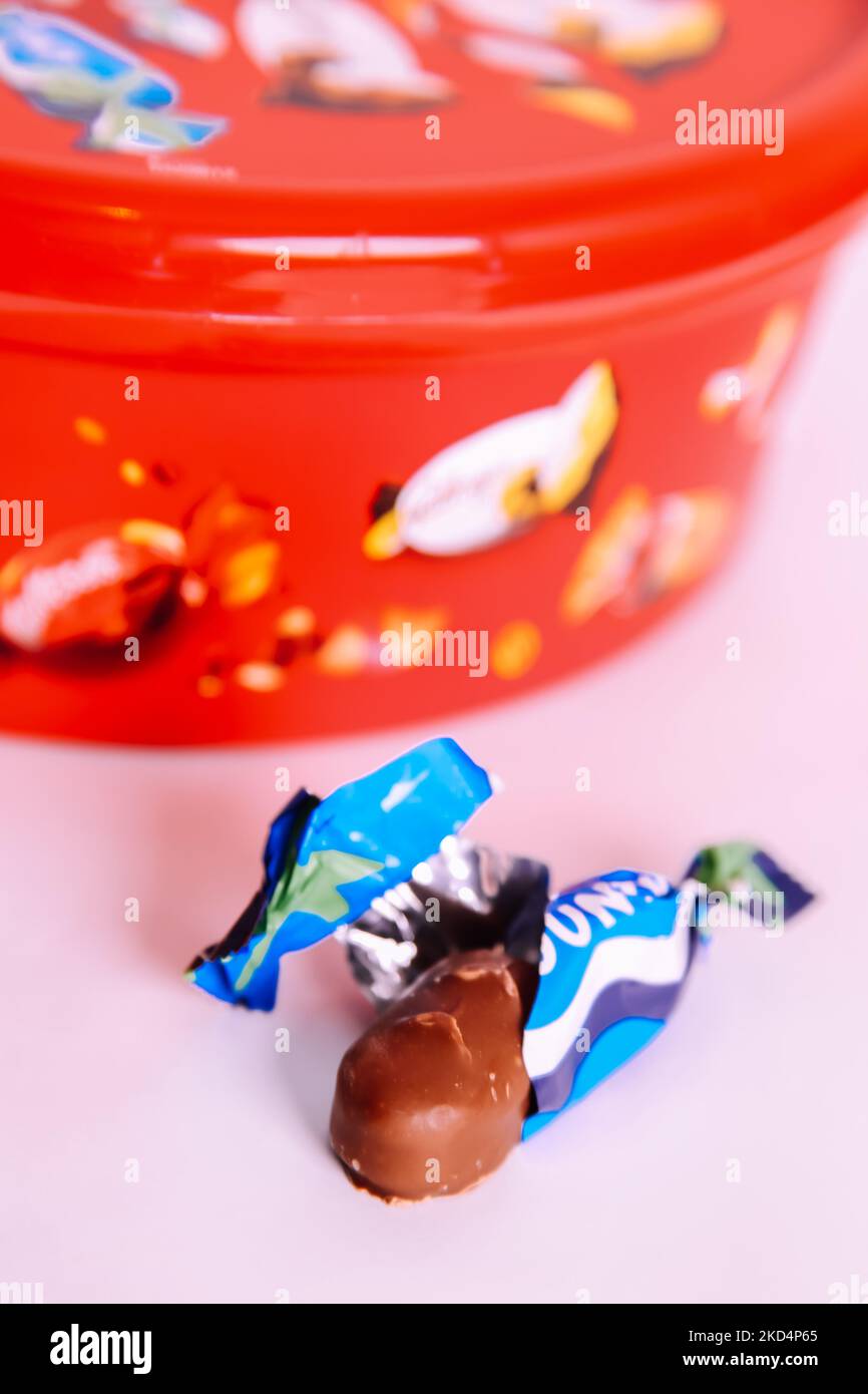 Plastic tub of Celebrations chocolate treat sweets 2022 Christmas edition - Bounty bar sweet left out Stock Photo