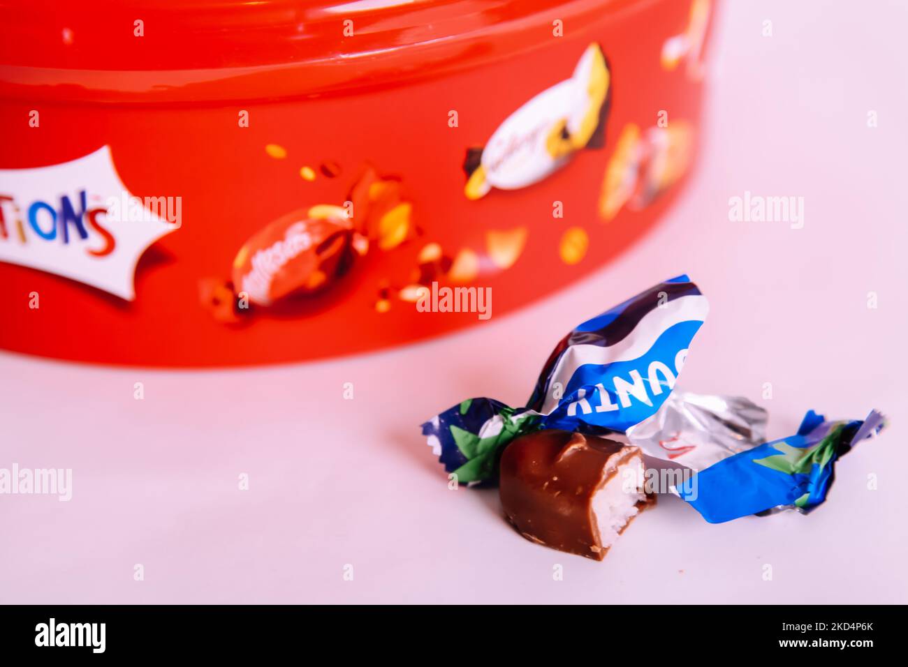 Plastic tub of Celebrations chocolate treat sweets 2022 Christmas edition - Bounty coconut chocolate bar sweet left out Stock Photo