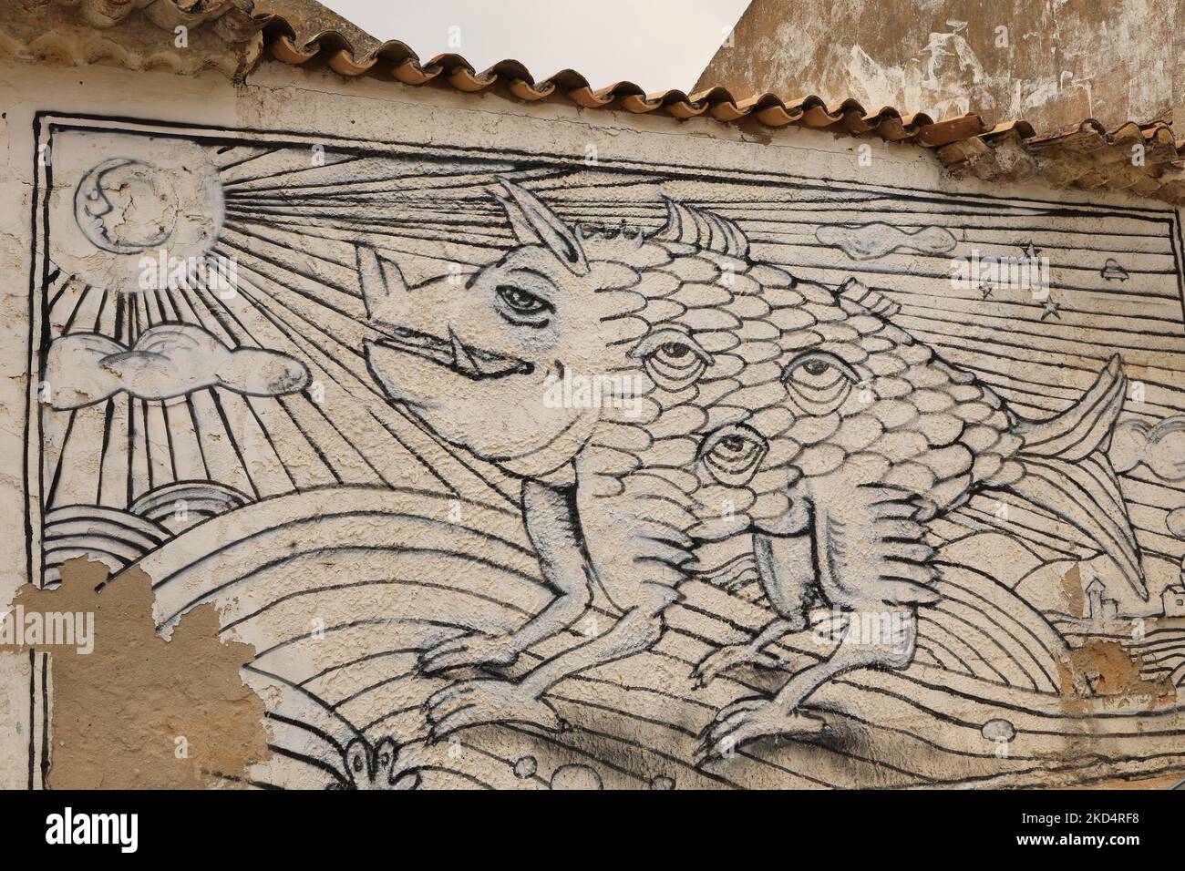 Street Art. A mural of an imaginary creature on an old building in old town Lagos, Algarve, Portugal Stock Photo