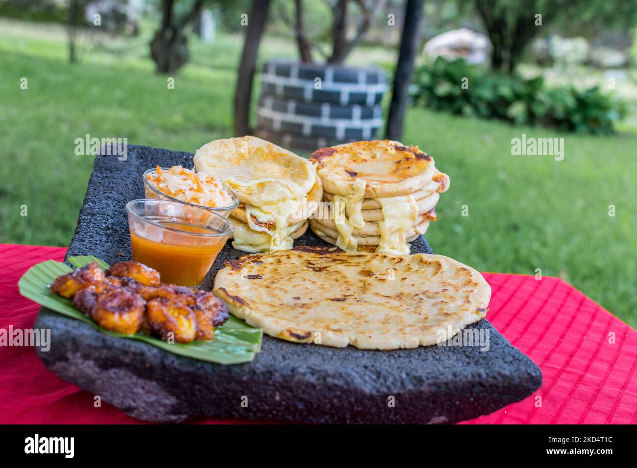 typical Salvadoran dish, cheese pupusas with cabbage and tomato sauce