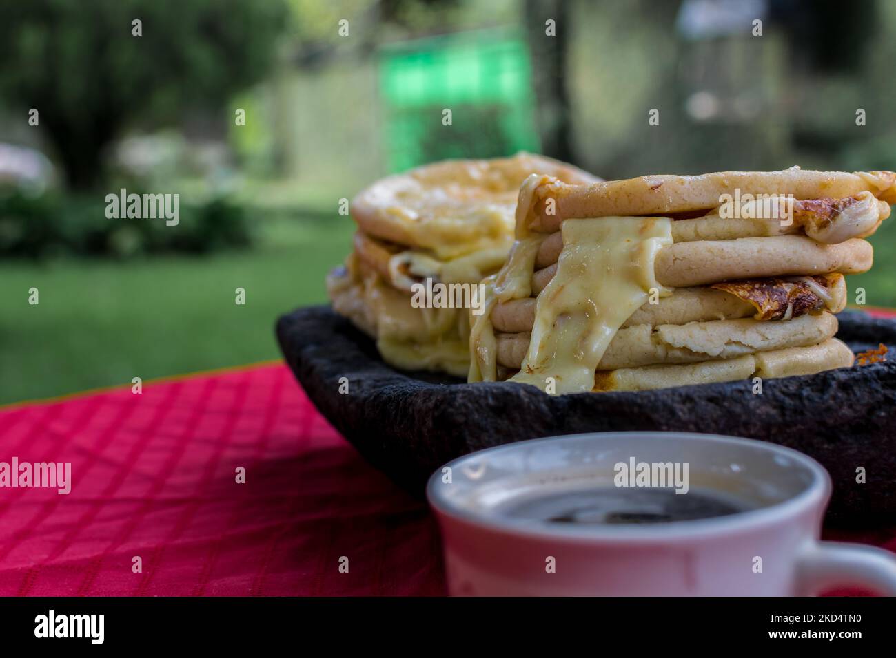 typical Salvadoran dish, cheese pupusas with cabbage and tomato sauce
