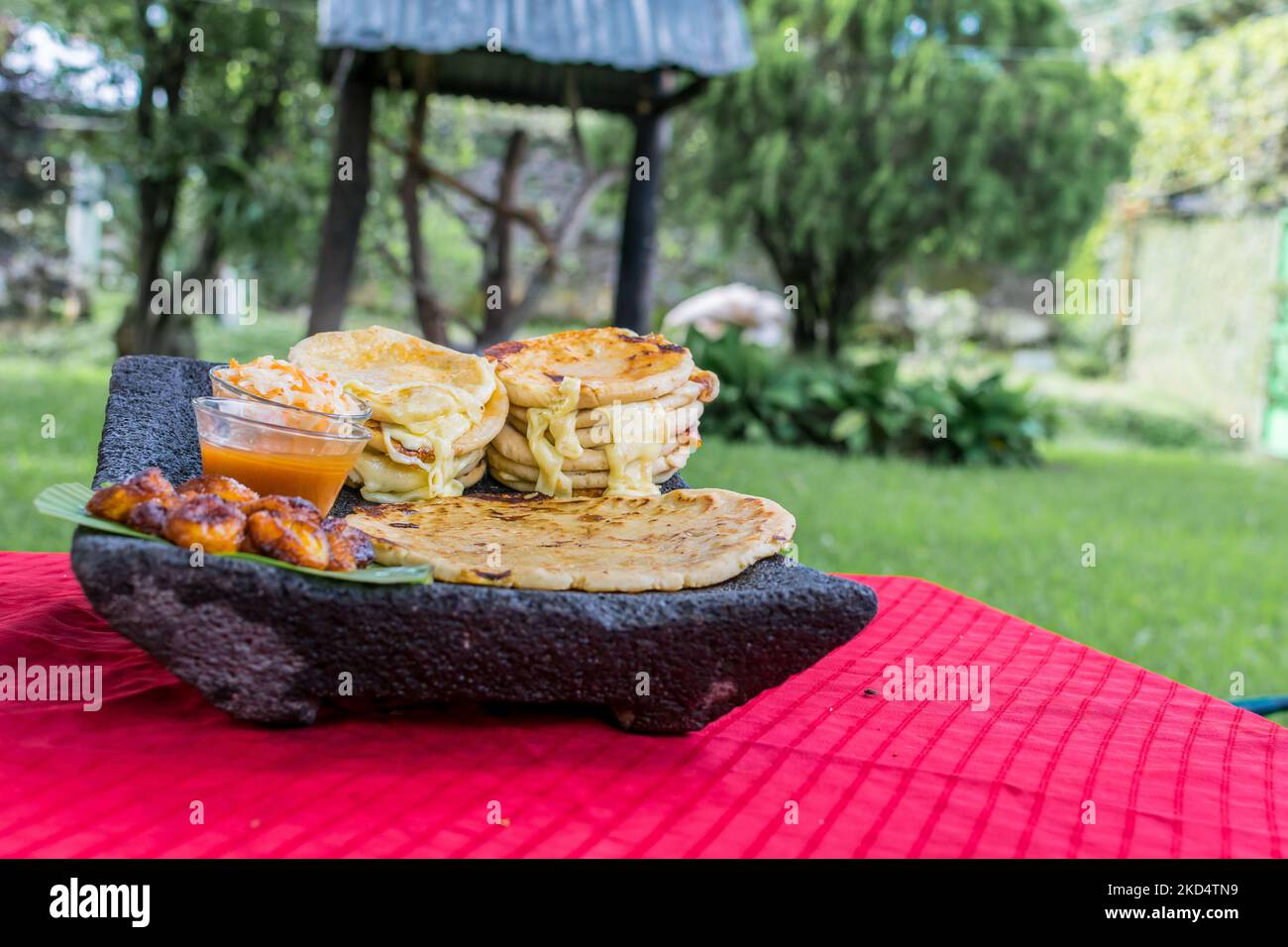 typical Salvadoran dish, cheese pupusas with cabbage and tomato sauce