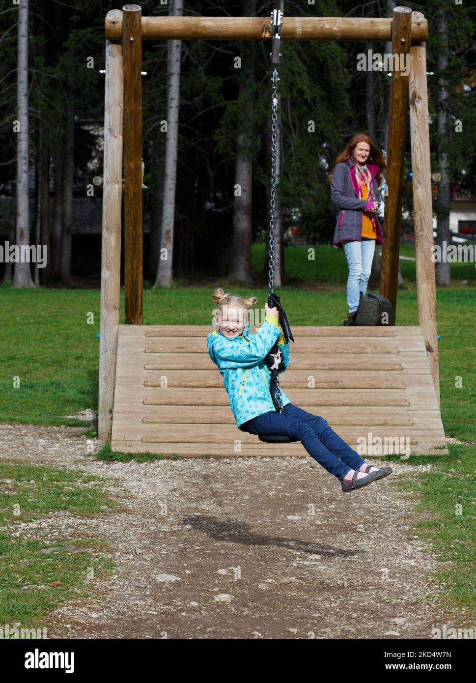 smiling little girl at the playground, Canazei, Italy Stock Photo - Alamy