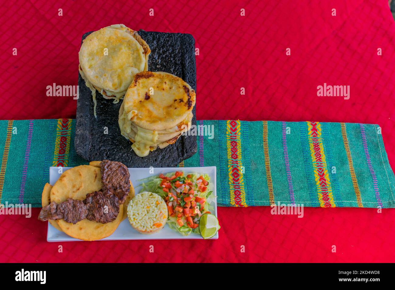 typical Salvadoran dish, cheese pupusas with cabbage and tomato sauce