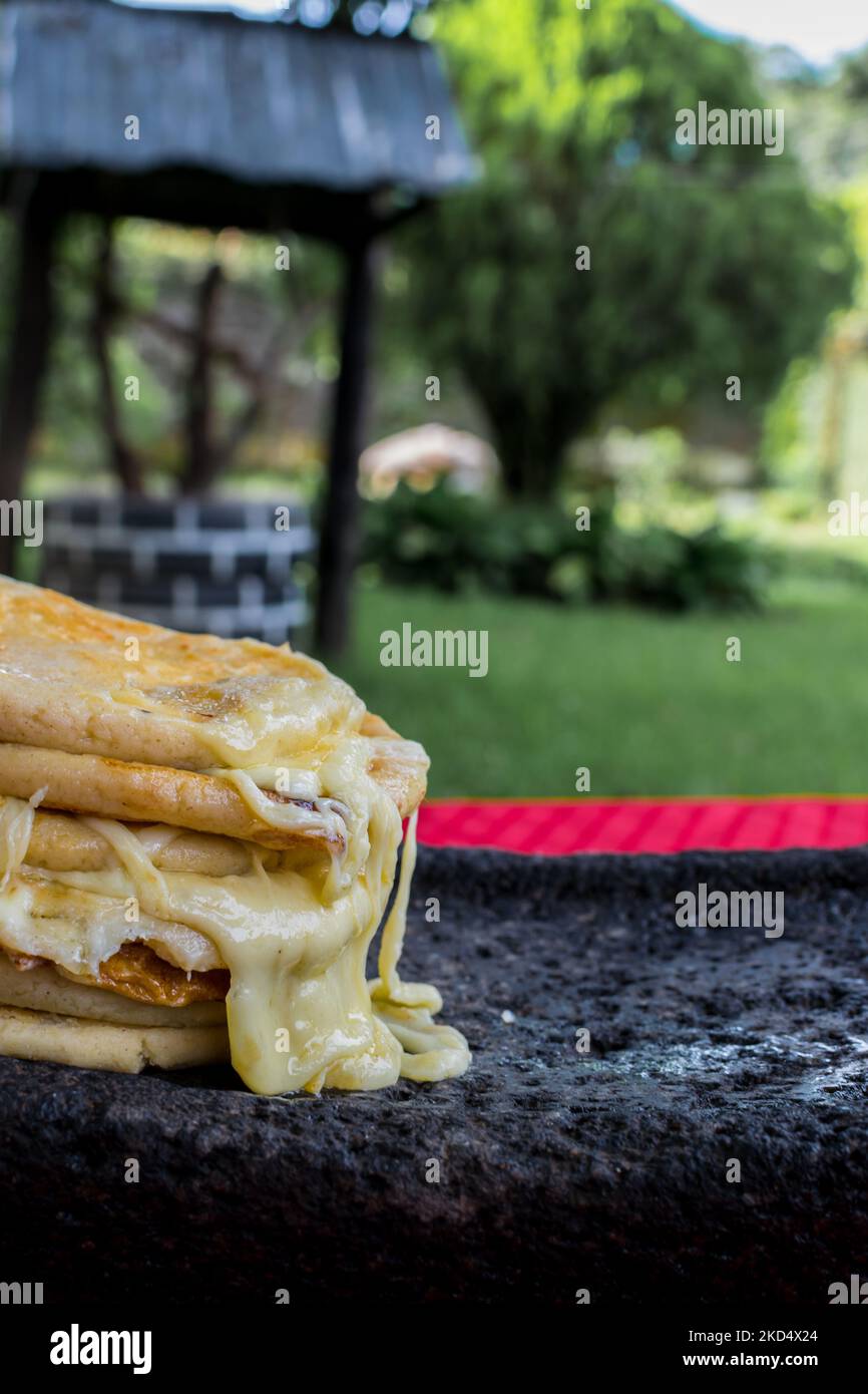 typical Salvadoran dish, cheese pupusas with cabbage and tomato sauce. rice and corn pupusas stuffed with cheese, beans or other ingredients Stock Photo