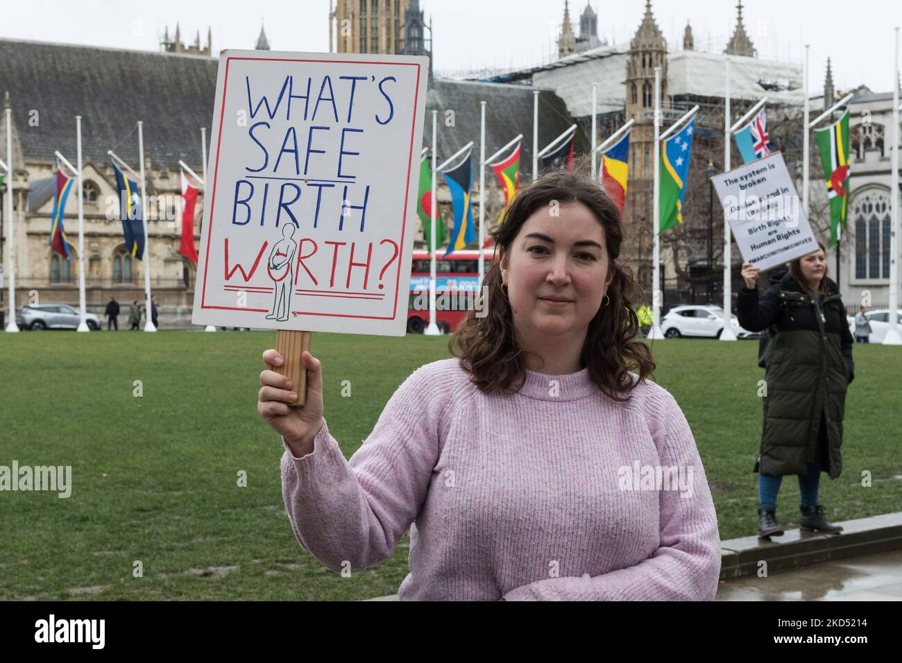 LONDON, UNITED KINGDOM - MARCH 13, 2022: A woman holds a placard as midwives, doulas, and birth workers demonstrate in Parliament Square calling on the government to act urgently in response to increased pressures on the maternity services including staff shortages and underfunding on March 13, 2022 in London, England. (Photo by WIktor Szymanowicz/NurPhoto) Stock Photo
