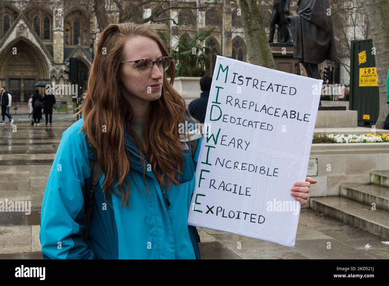 LONDON, UNITED KINGDOM - MARCH 13, 2022: A woman holds a placard as midwives, doulas, and birth workers demonstrate in Parliament Square calling on the government to act urgently in response to increased pressures on the maternity services including staff shortages and underfunding on March 13, 2022 in London, England. (Photo by WIktor Szymanowicz/NurPhoto) Stock Photo