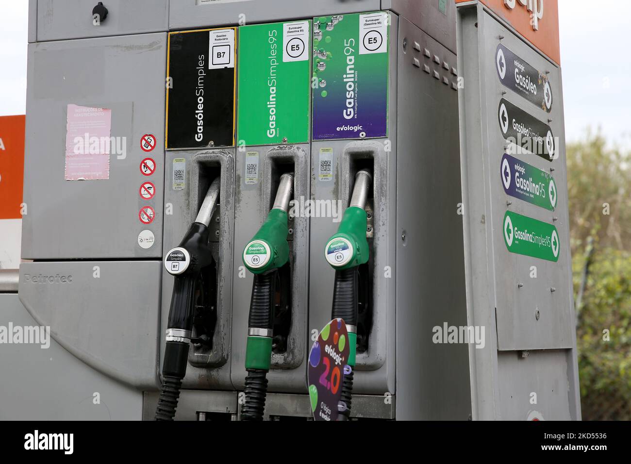 Gas pumps are seen at a gas station with the price of fuel exceeding 2