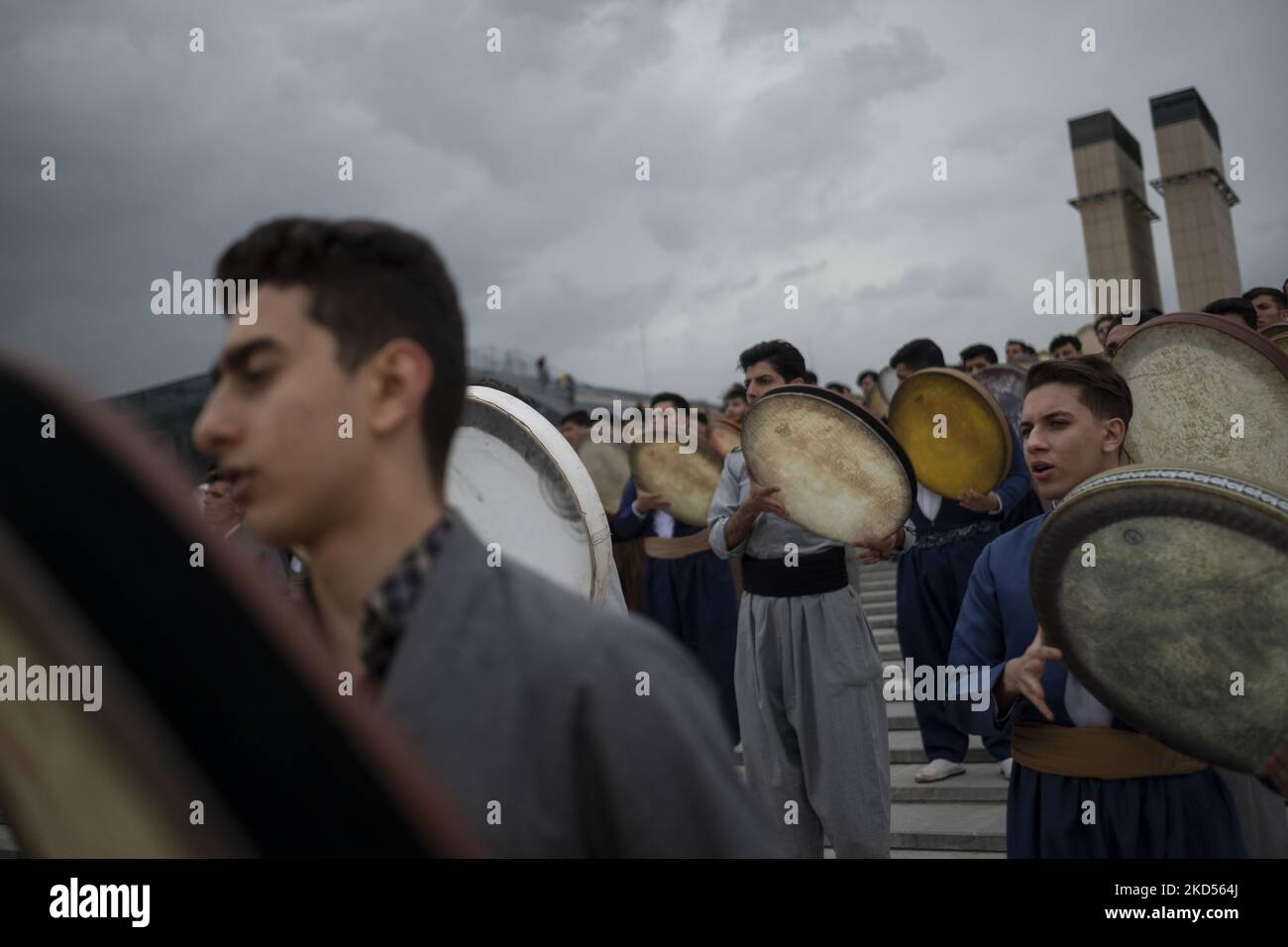 Iranian-Kurds play Def which is a traditional musical instrument, in a ...