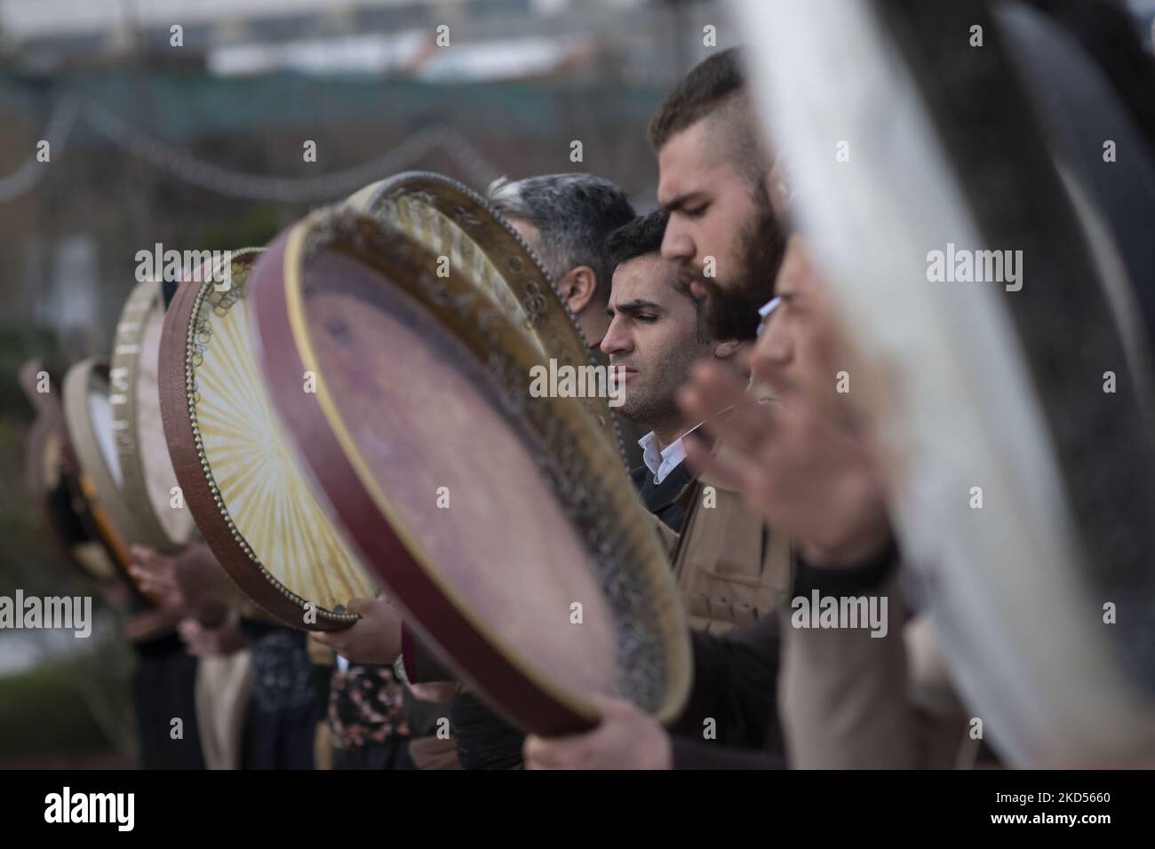 Iranian-Kurds play Def which is a traditional musical instrument, in a ...