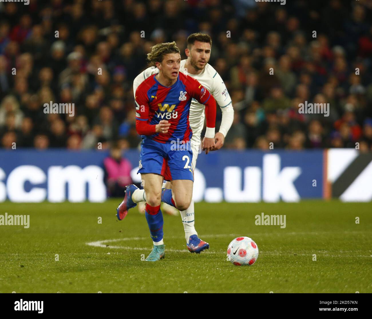 L-R Crystal Palace's Conor Gallagher (on loan from Chelsea) and Manchester City's Aymeric Laporte during Premier League between Crystal Palace and Manchester City at Selhurst Park Stadium, London on 14th March, 2022 (Photo by Action Foto Sport/NurPhoto) Stock Photo