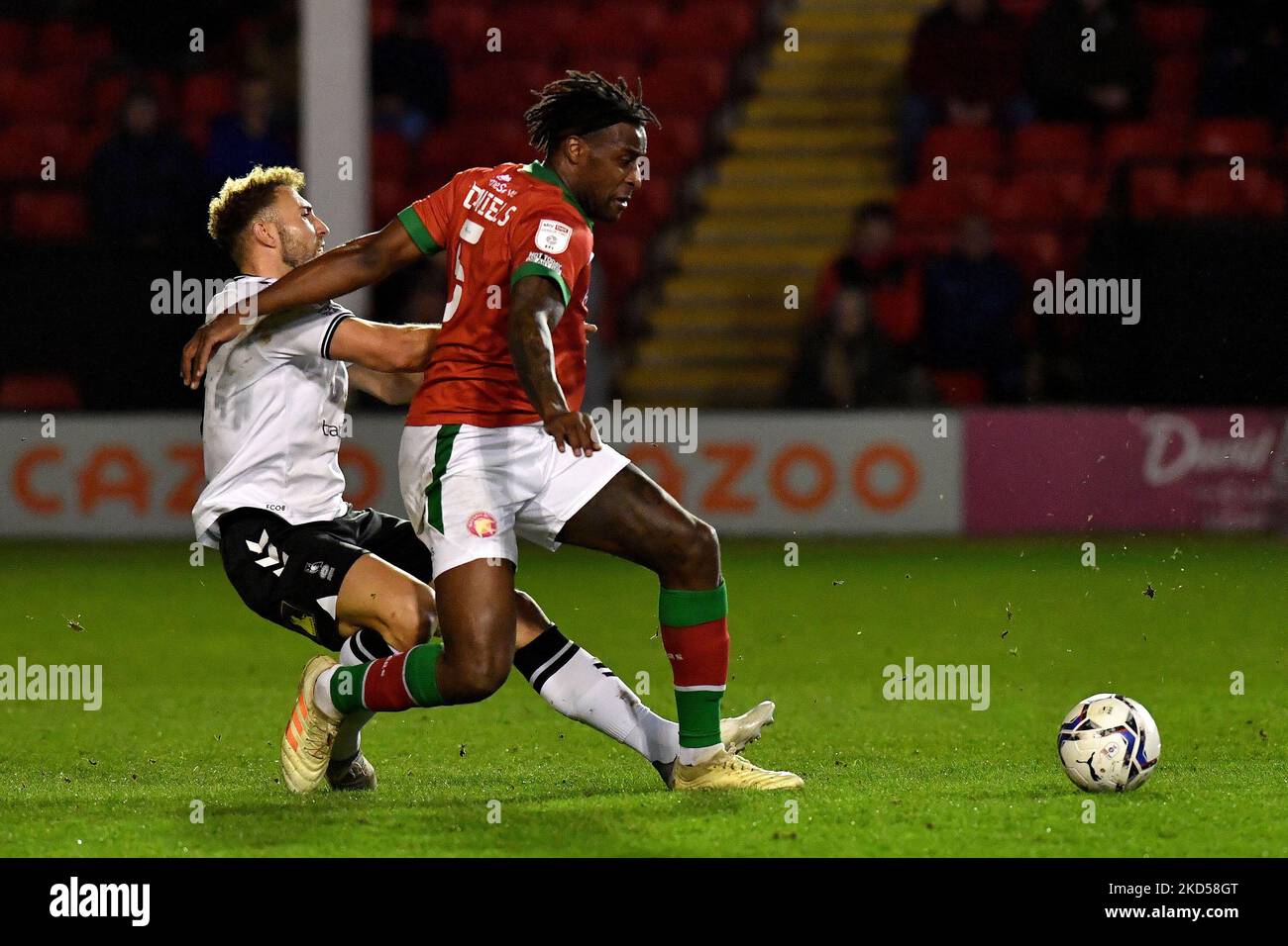 Oldham Athletic's Hallam Hope tussles with Donervon Daniels of Walsall Football Club during the Sky Bet League 2 match between Walsall and Oldham Athletic at the Banks's Stadium, Walsall on Tuesday 15th March 2022. (Photo by Eddie Garvey/MI News/NurPhoto) Stock Photo