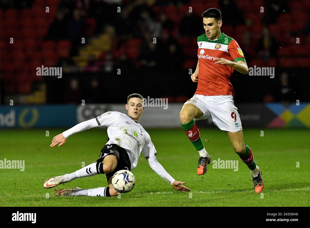 Oldham Athletic's Alex Hunt tussles with Conor Wilkinson of Walsall Football Club during the Sky Bet League 2 match between Walsall and Oldham Athletic at the Banks's Stadium, Walsall on Tuesday 15th March 2022. (Photo by Eddie Garvey/MI News/NurPhoto) Stock Photo