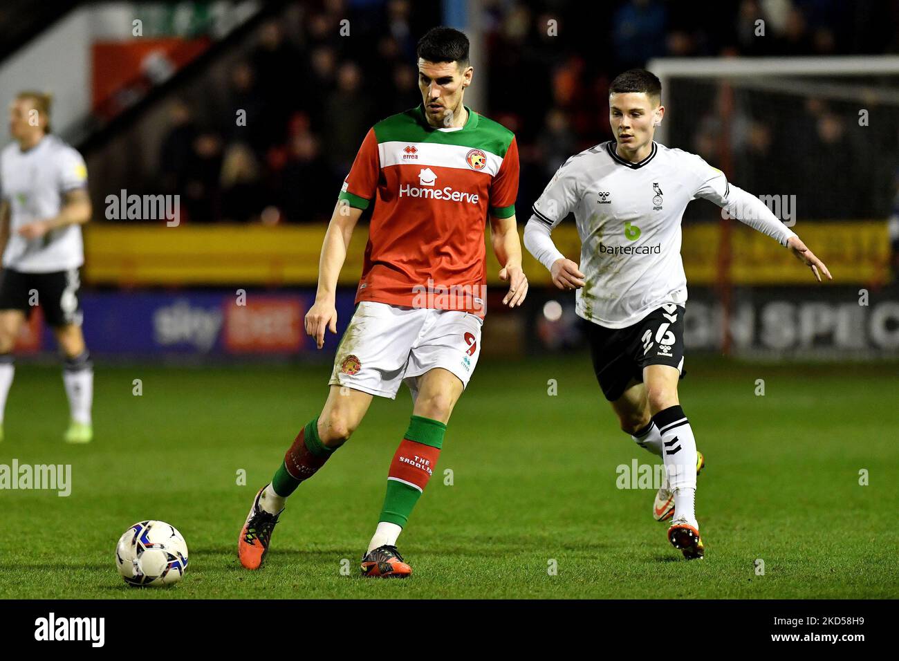 Oldham Athletic's Alex Hunt tussles with Conor Wilkinson of Walsall Football Club during the Sky Bet League 2 match between Walsall and Oldham Athletic at the Banks's Stadium, Walsall on Tuesday 15th March 2022. (Photo by Eddie Garvey/MI News/NurPhoto) Stock Photo