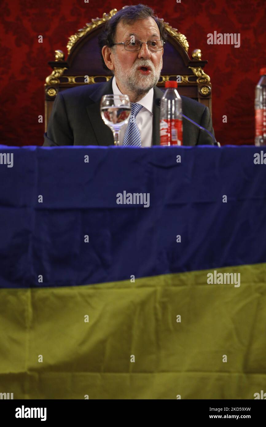 The former Prime Minister of Spain, Mariano Rajoy, sitting next to a Ukrainian flag during a presentation of his book entitled Politics for adults in Granada, Spain on March 16, 2022. (Photo by Ãlex CÃ¡mara/NurPhoto) Stock Photo