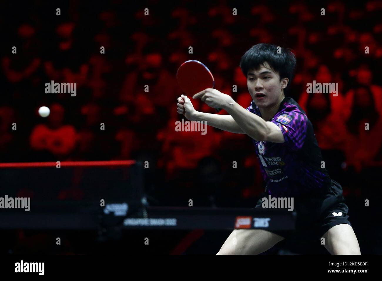 Lin YunJu of Chinese Taipei plays a shot against Ma Long of China