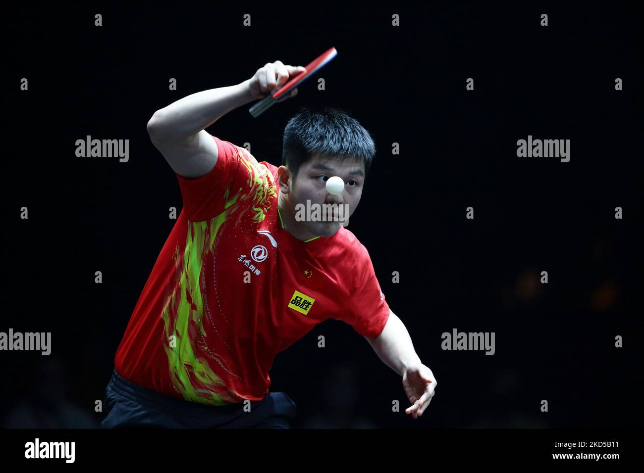 Fan Zhendong of China plays a shot against Patrick Franziska of Germany during the Men's Singles Quarterfinals match of Singapore Smash 2022 at OCBC Arena on March 17, 2022 in Singapore. (Photo by Suhaimi Abdullah/NurPhoto) Stock Photo