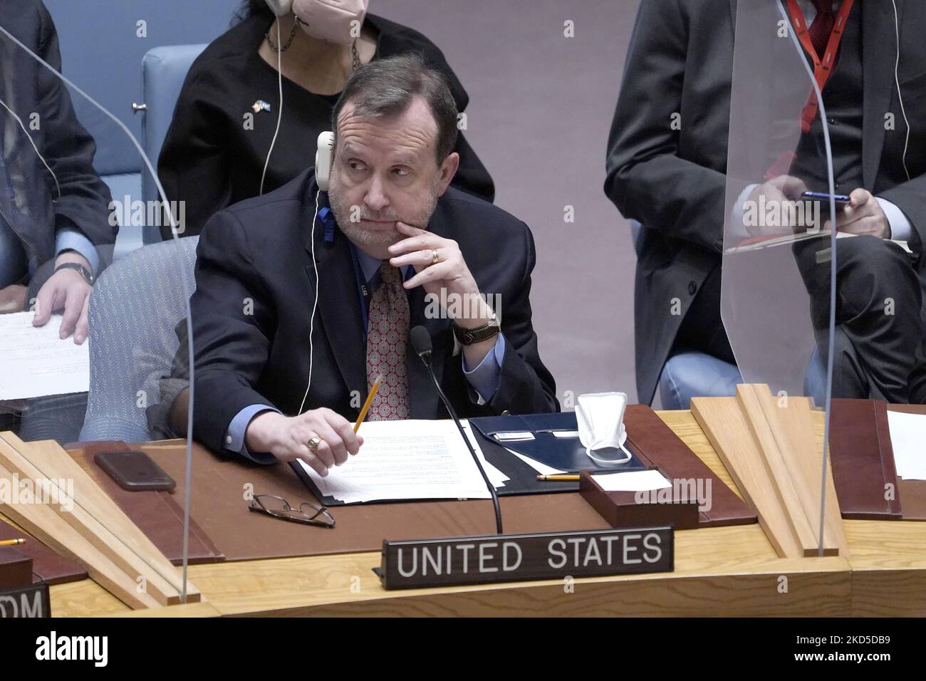Richard M. Mills, Deputy Representative of the United States of America to the United Nations listens during a Security Council Meeting addressing the Russian invasion of Ukraine at the United Nations Headquarters on March, 18, 2022 in New York City, USA. Increasingly concerned about the invasion and the cost of civilian lives, members of the Security Council vehemently demanded that a pathway for immediate humanitarian relief and peace be set. (Photo by John Lamparski/NurPhoto) Stock Photo