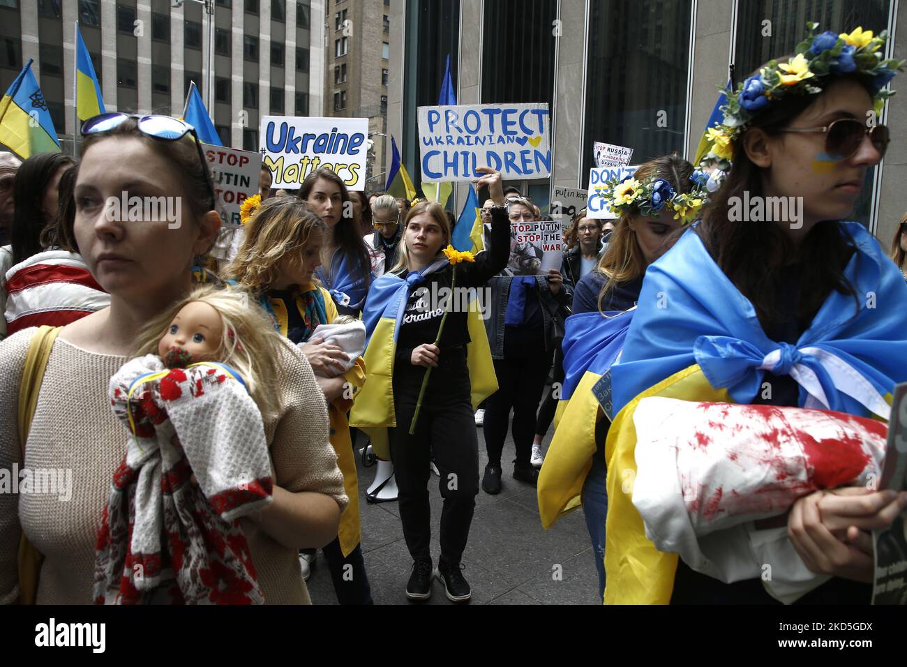 Ukrainian supporters chant slogans holding signs and flags during a rally in front of the FOX News building on March 19-2022 in New York City USA. As the Russian invasion of Ukraine escalates with intense shelling and targeting of civilians, demonstrators demand a no-fly zone over the country. (Photo by John Lamparski/NurPhoto) Stock Photo