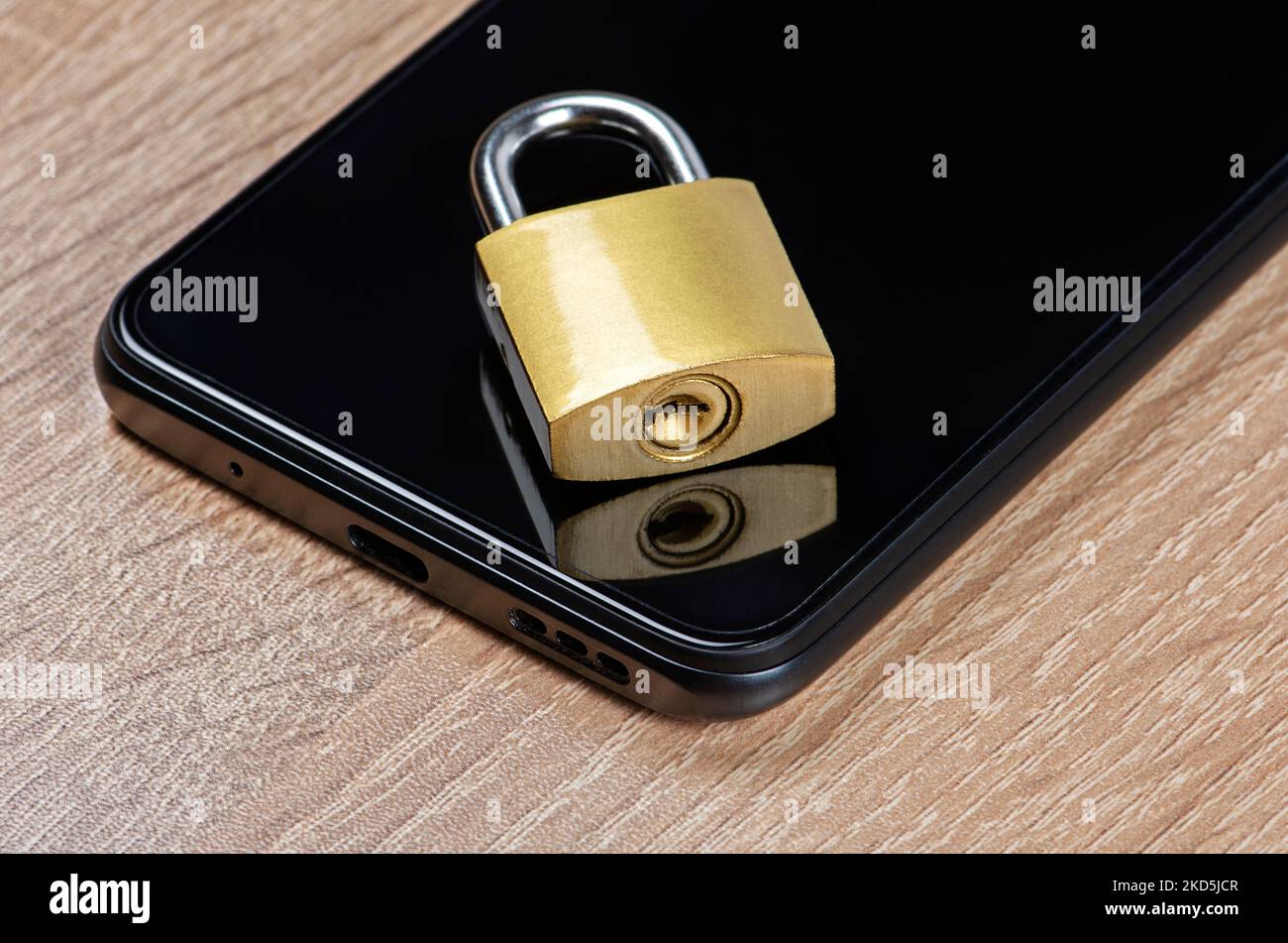 Smartphone with lock and key. Concept of cyber safety Stock Photo