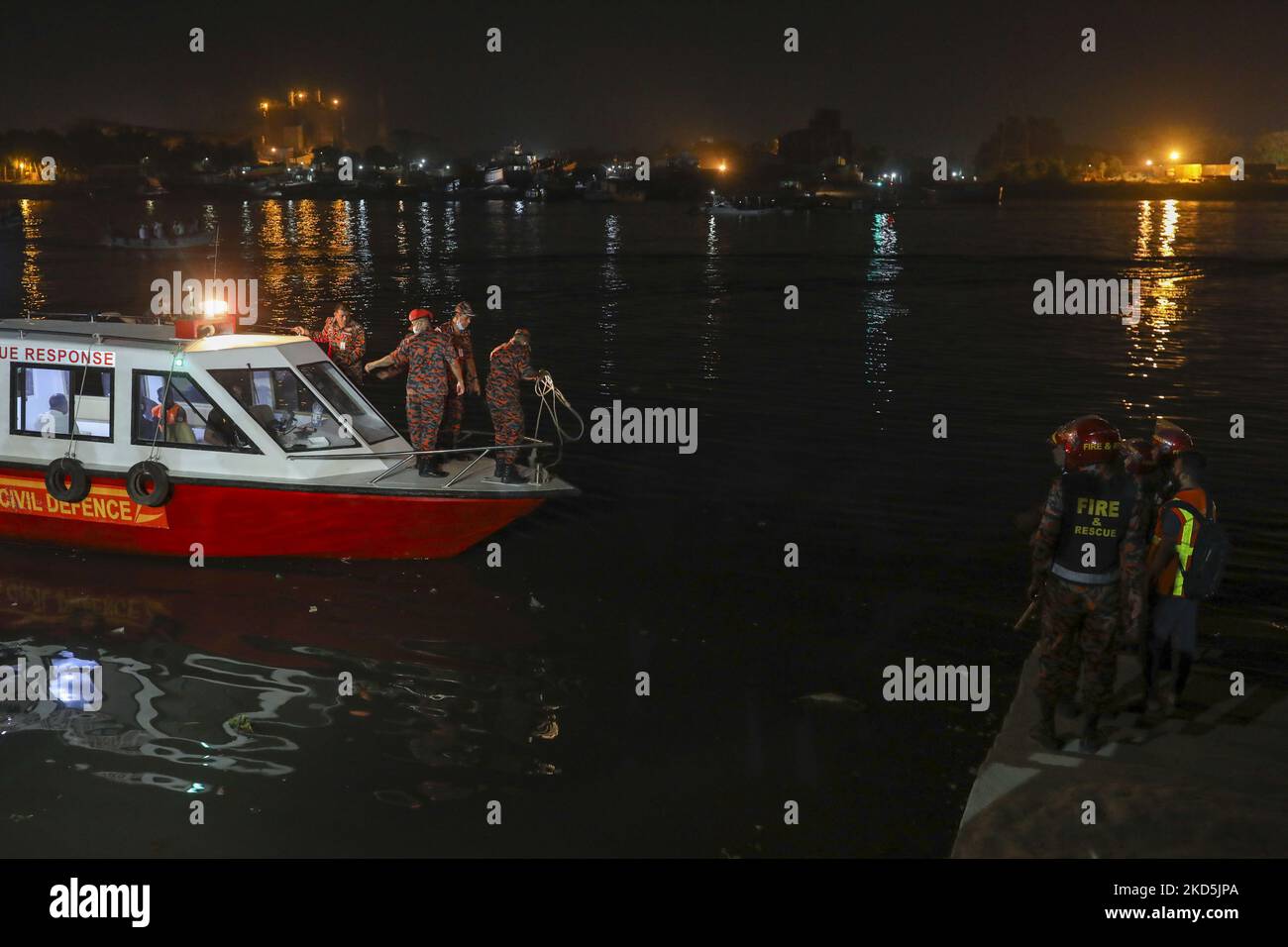 Rescue workers try to collect dead bodies from a sunken ferry in Shitalakshya river in Narayanganj, Bangladesh on March 20, 2022. Six bodies were recovered, it is not clear immediately how many are still missing. (Photo by Kazi Salahuddin Razu/NurPhoto) Stock Photo