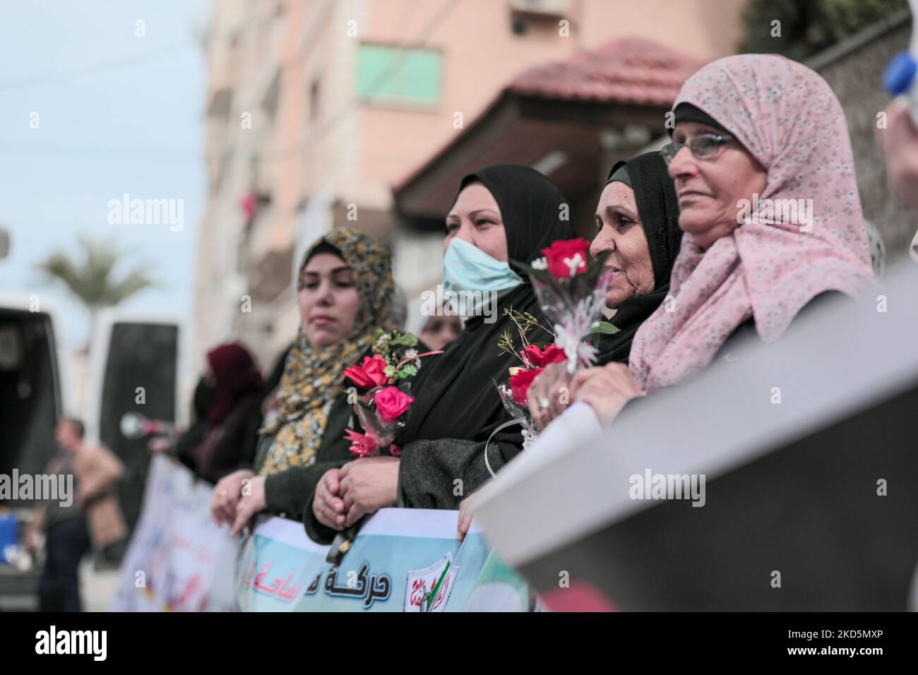 Mothers of Palestinian prisoners carry roses on International Mother's Day during a stand in solidarity with their sons in Israeli prisons(Photo by Momen Faiz/NurPhoto) Stock Photo