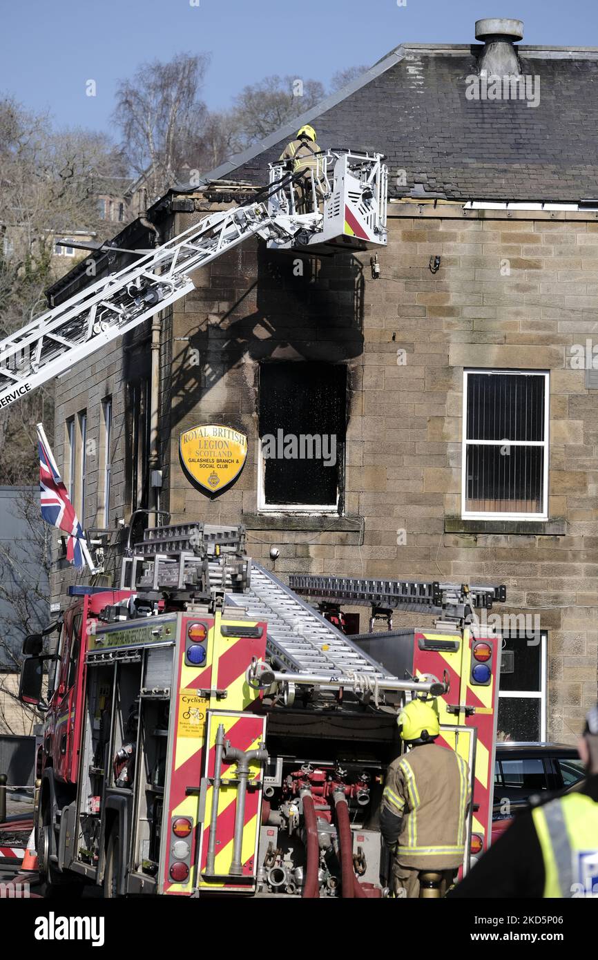 A firefighter on an elevated platform working at a fire at the Royal British Legion in Park Street, Galashiels on Monday 21 March 2022. Fire Scotland attended with four pumps and an elevated access platform to deal with the blaze in the 2 storey building in the centre of town (Photo by Rob Gray/NurPhoto) Stock Photo