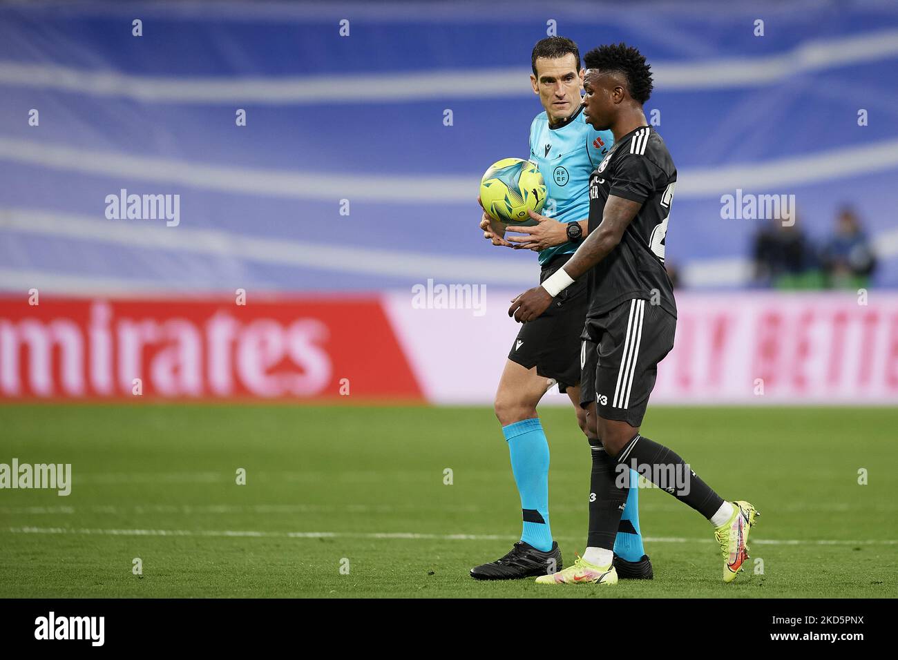 Referee Juan Martinez Munuera and Vinicius Junior of Real Madrid talk