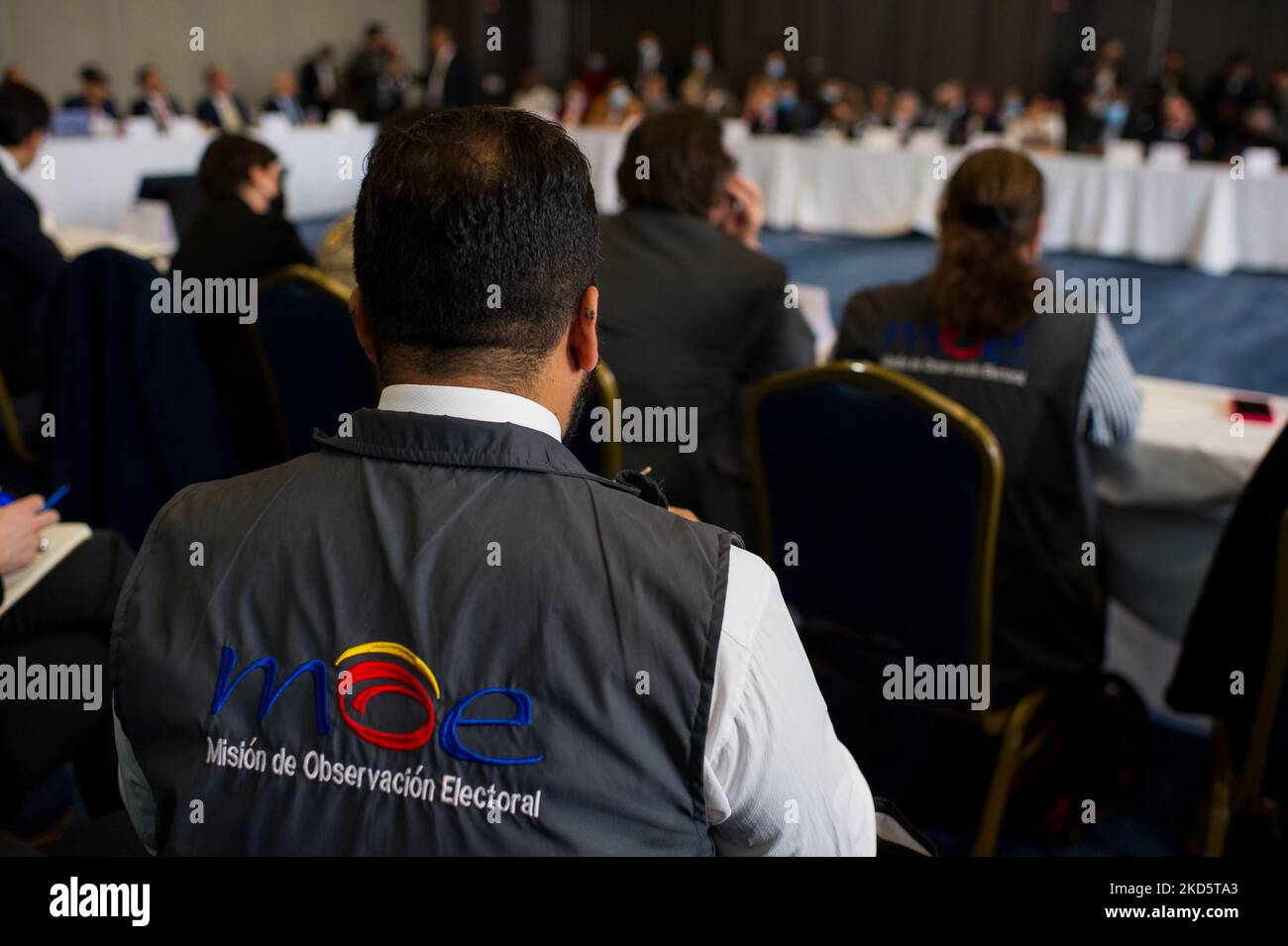 Members of the electorial observation mision 'MOE' during a meeting of electoral guarantees were national registrar Alexander Vega opted not to do a new election count for the 2022 congressional elections, in Bogota, Colombia March 22, 2022. (Photo by Sebastian Barros/NurPhoto) Stock Photo