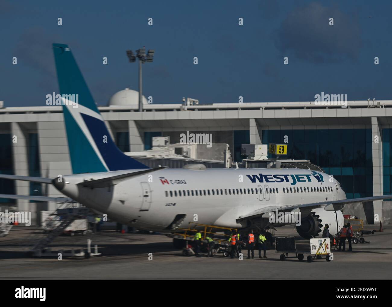 WestJet Airline plane seen at Cancun International Airport. On