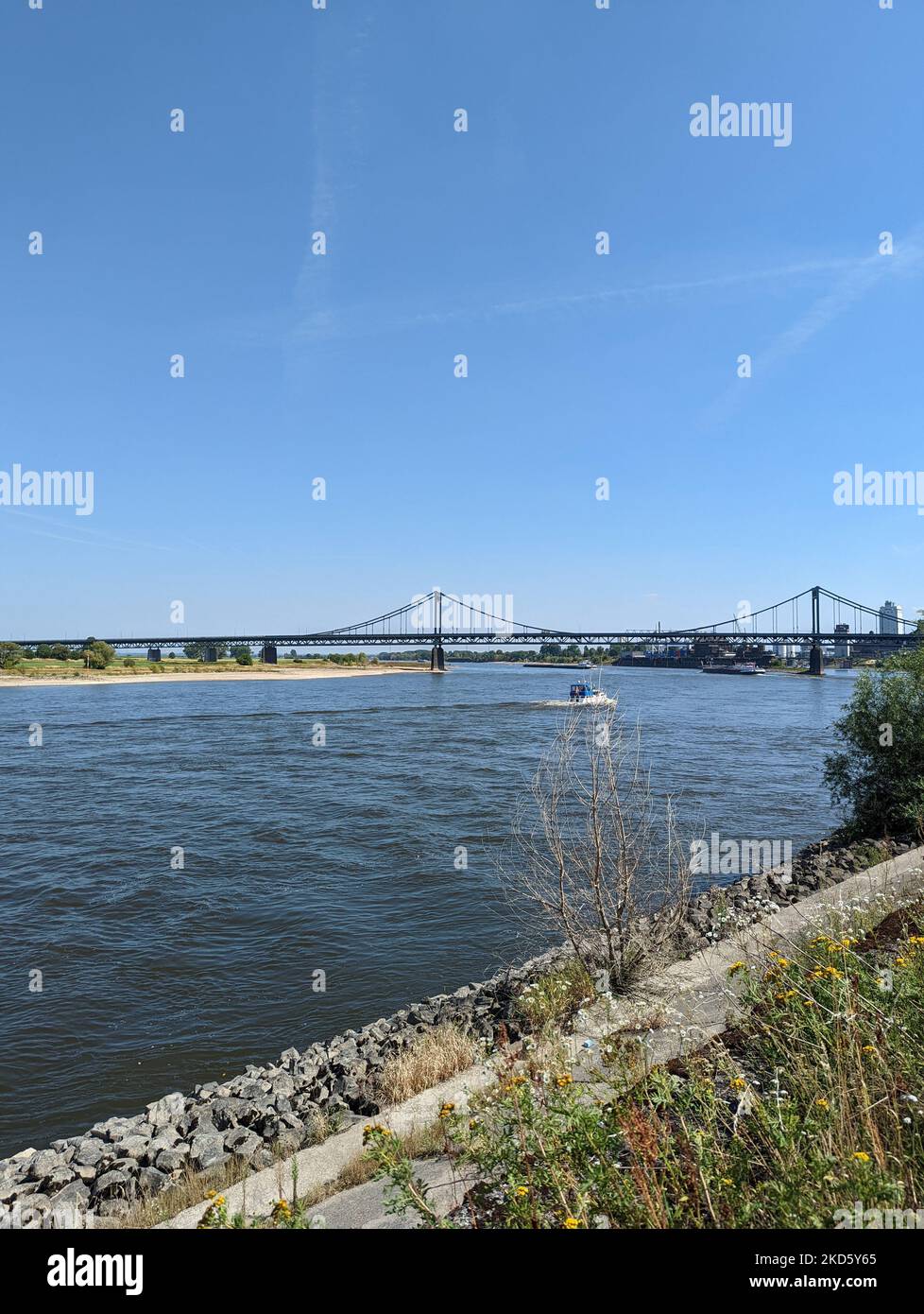 A vertical shot of the historical Iron Bridge across the River Rhine at Krefeld Uerdingen Stock Photo