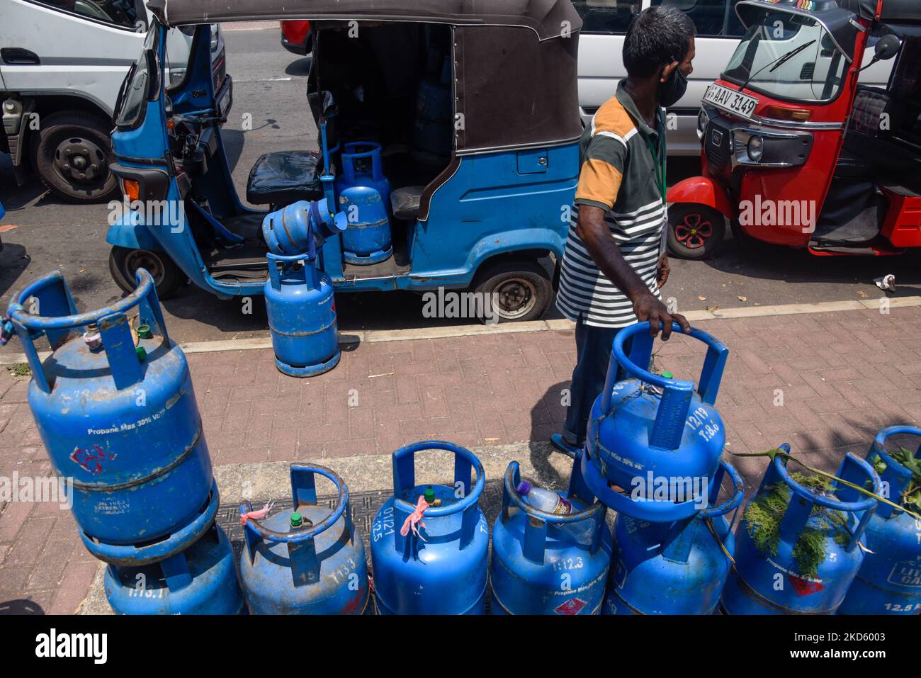 Gas cylinder line up near gas station ongoing economic crisis in